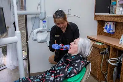 woman getting dental x-rays during her appointment at Mills Dental Group in Houston, TX